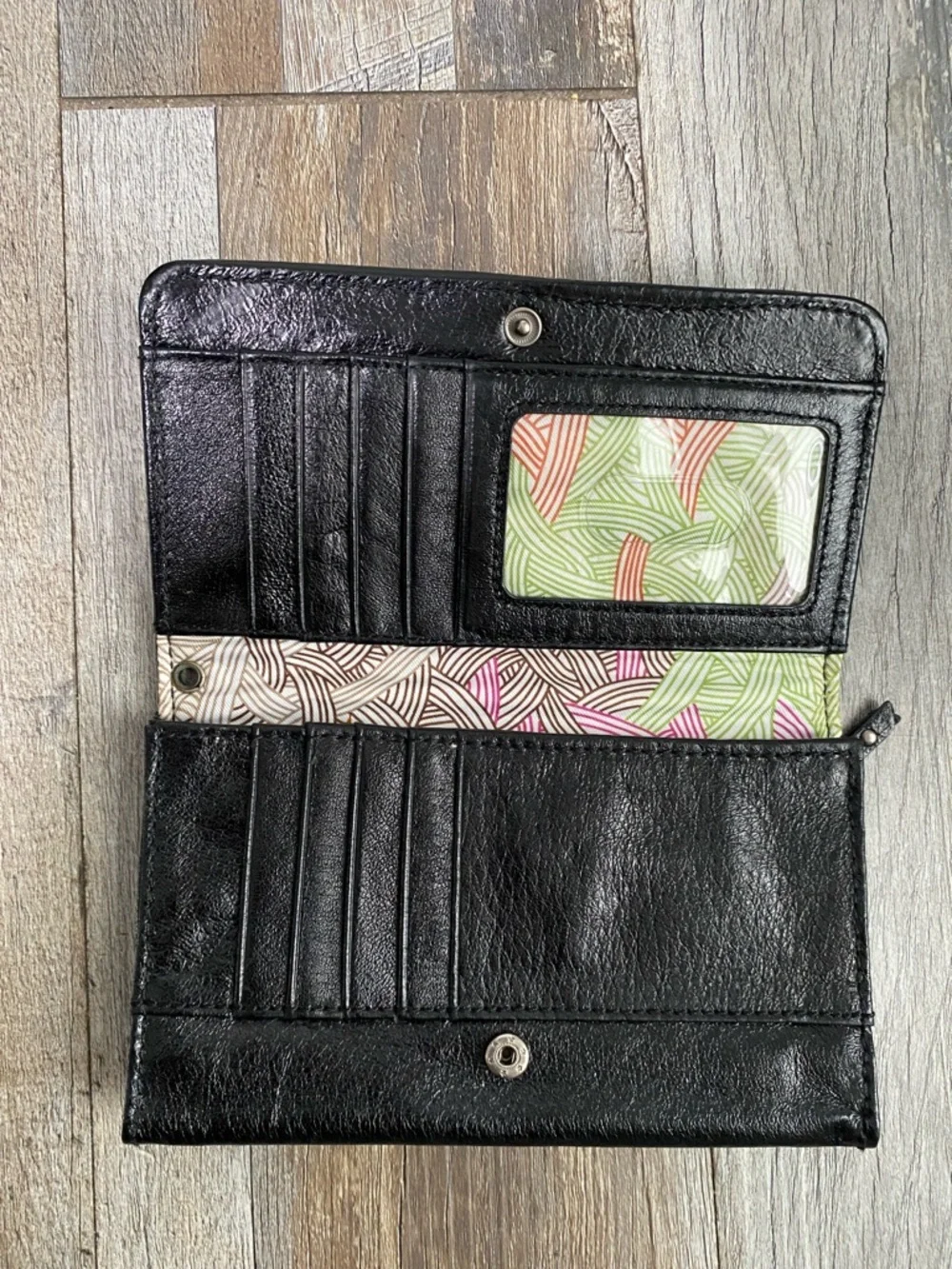 The Sak Black Quilted Eyelet Trifold Leather Wallet with Logo Plaque